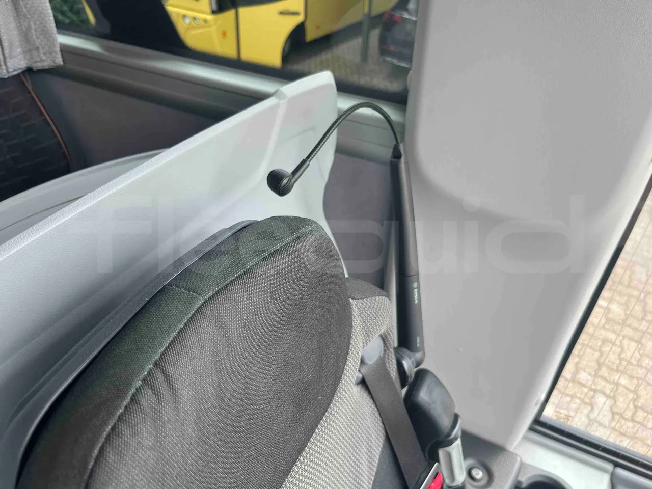 Man Lion's Coach - driver microphone accessories photo