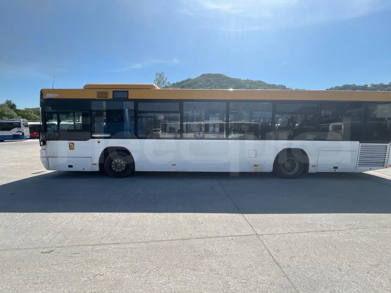 Man Lion's City T A78 - EUR4 - 191kW - 11.857m - left side photo