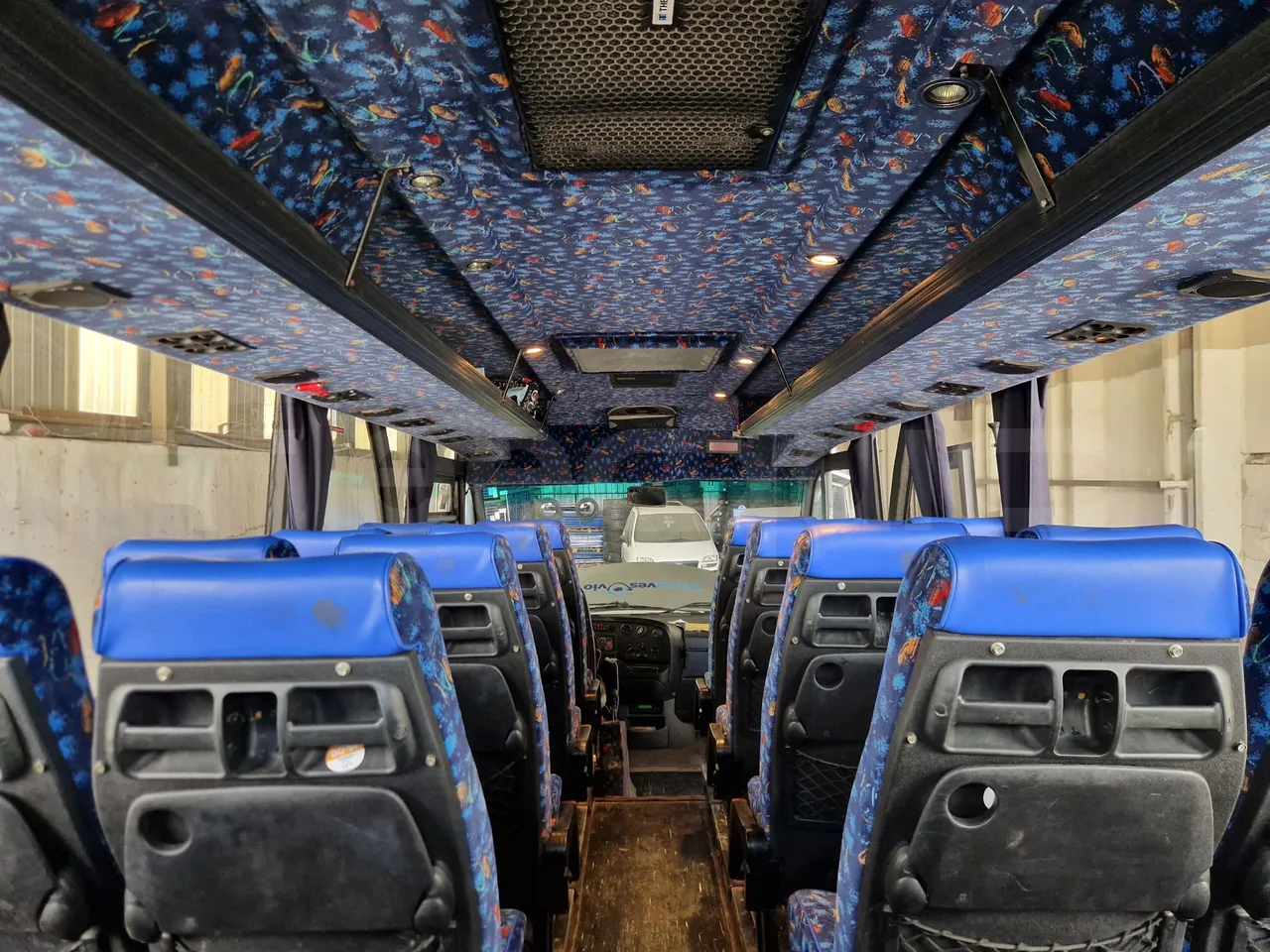 Iveco 65C15/70 JB - forward view all seats last row height