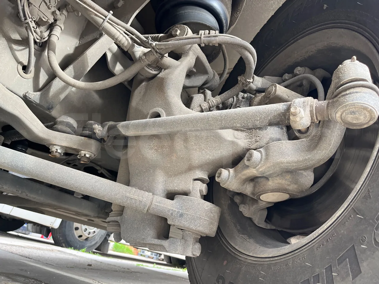 Man Noge Touring345 - EUR3 -  301kW - 13.000m - front axle left side